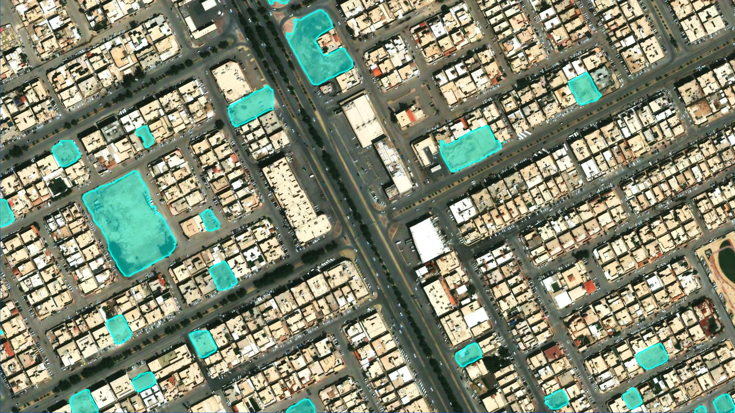 The same image with vacant land highlighted by the model